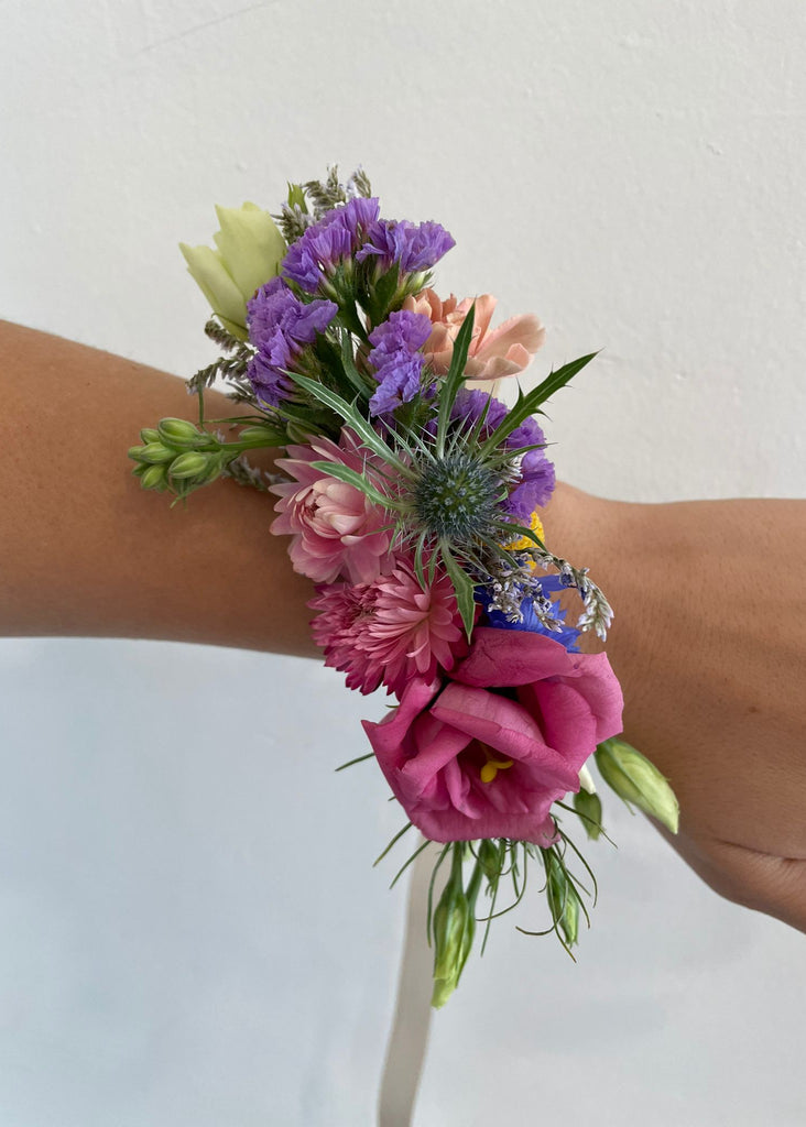 Twiggies flower corsage made with bright colored premium flowers and ribbon 